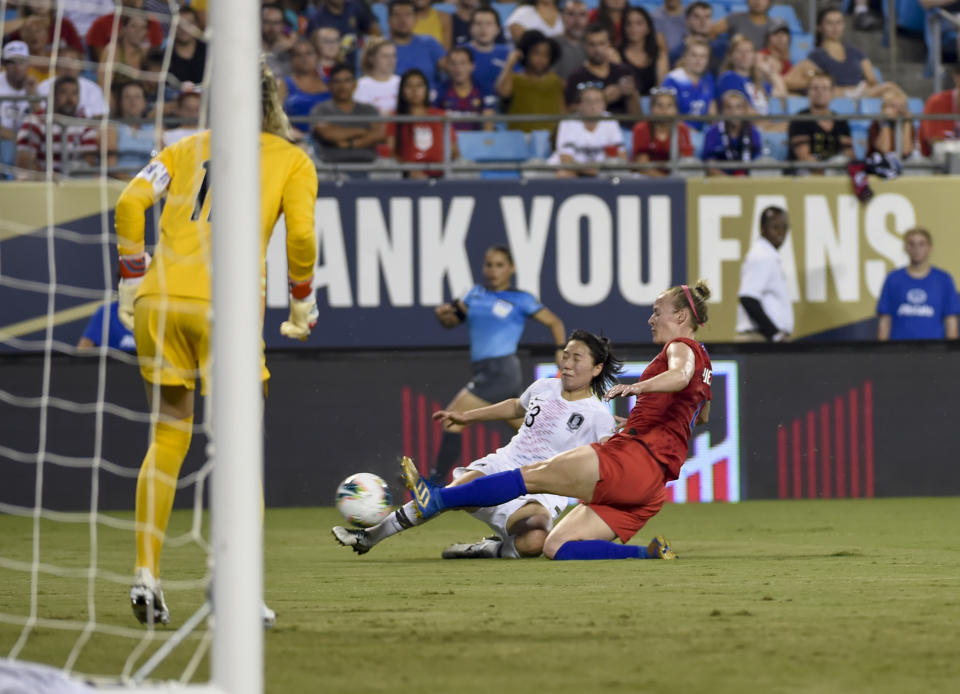 United States' Becky Sauerbrunn, (4) tackles South Korea's Kang Chaerim, (23) during a soccer match Thursday, Oct. 3, 2019, in Charlotte, N.C. (AP Photo/Mike McCarn)