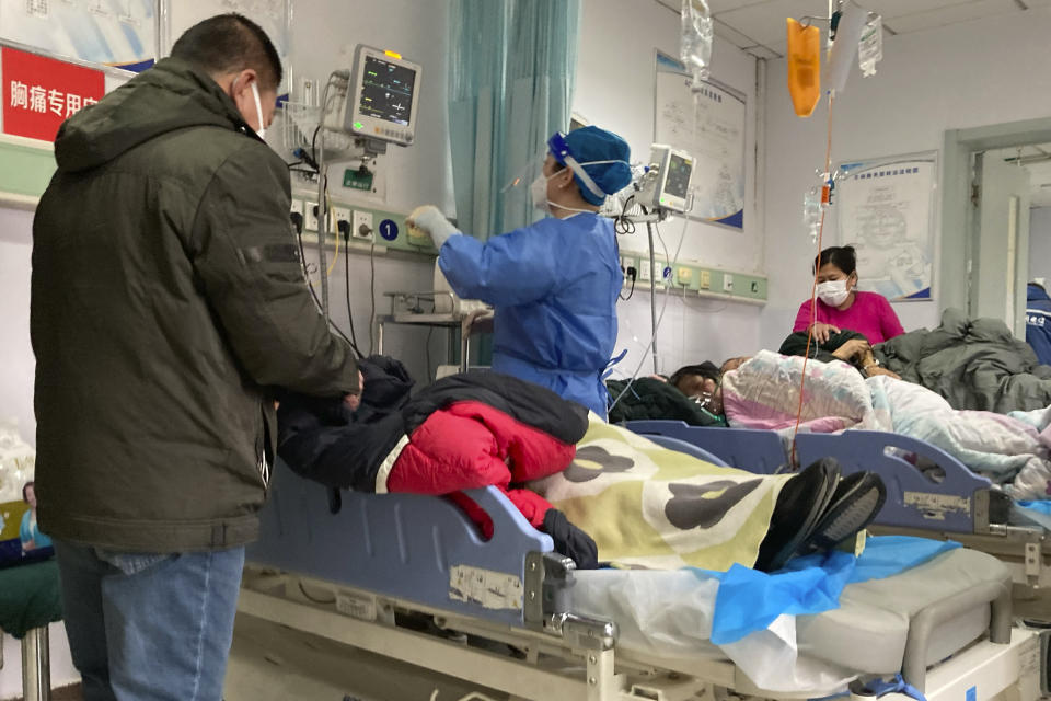 FILE - Patients lie on their beds at the Baoding No. 2 Central Hospital in Zhuozhou city in northern China's Hebei province on Wednesday, Dec. 21, 2022. Nearly three years after it was first identified in China, the coronavirus is now spreading through the vast country. Experts predict difficult months ahead for its 1.4 billion people. (AP Photo/Dake Kang, File)