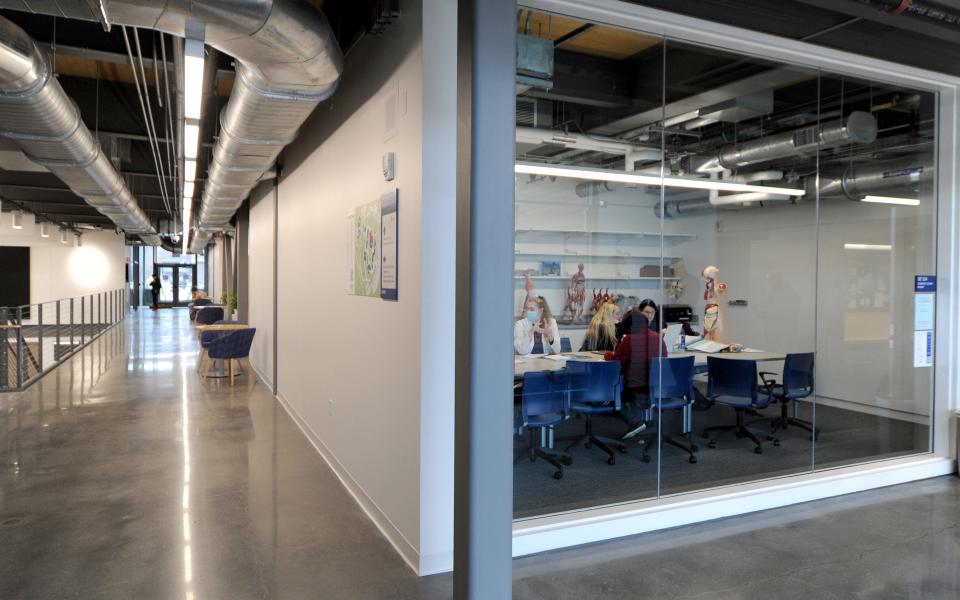 Students work Oct. 18 in the science study room, which features a glass wall. The Frank and Maureen Wilkens Science and Engineering Center on the Cape Cod Community College campus in West Barnstable officially opened in September. Merrily Cassidy/Cape Cod Times