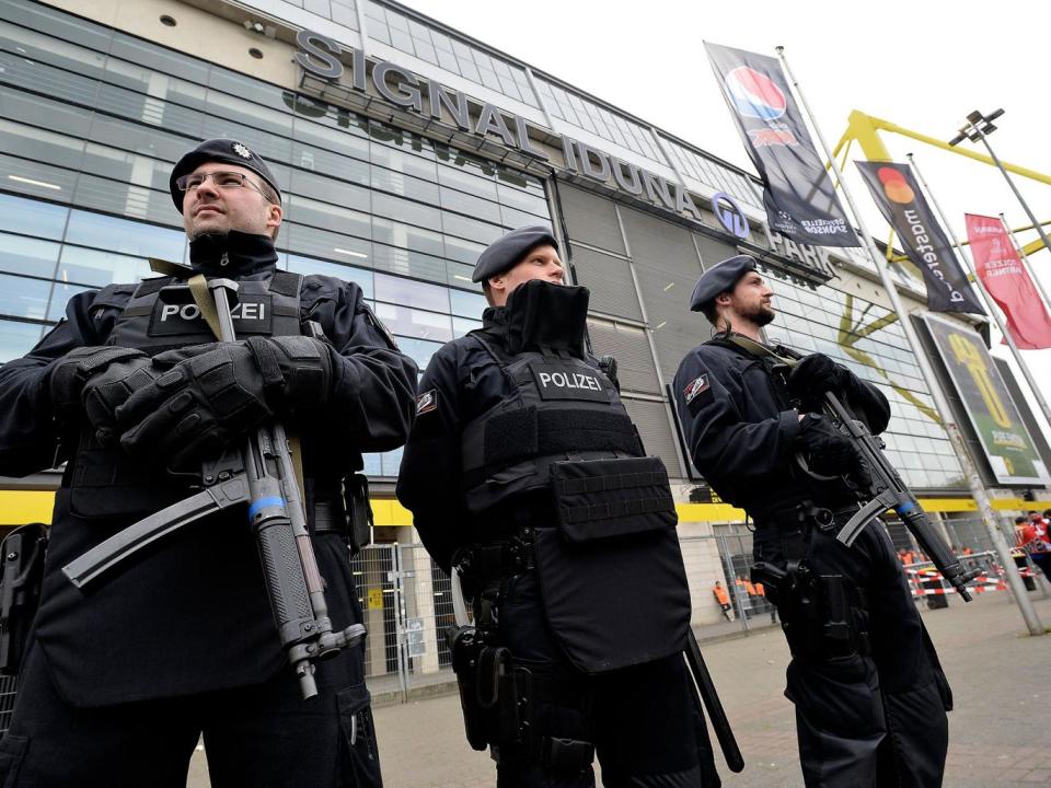 Officers secure Borussia Dortmund’s stadium ahead of the Champions League tie (EPA)