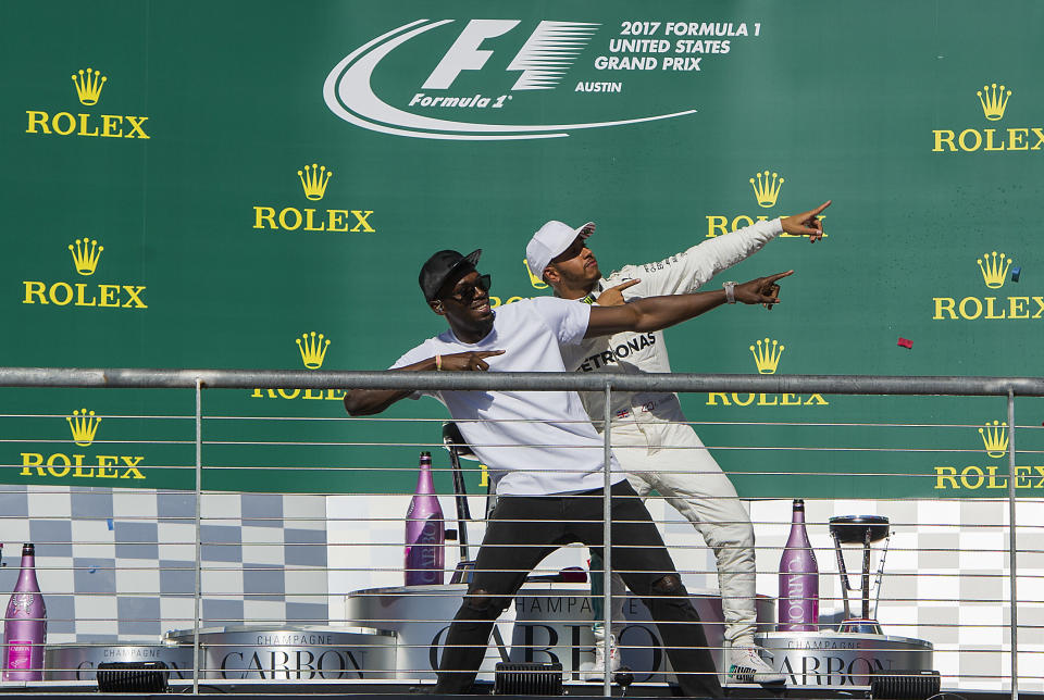 Top cats: Usain Bolt and Lewis Hamilton throw a familiar shape on the Austin podium at the 2017 US Grand Prix
