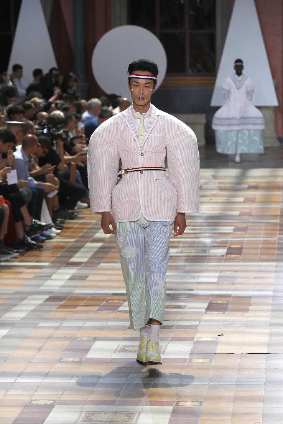 A model wears a creation for the Thom Browne mens Spring-Summer 2020 fashion collection presented in Paris, Saturday, June 22 2019. (AP Photo/Michel Euler)