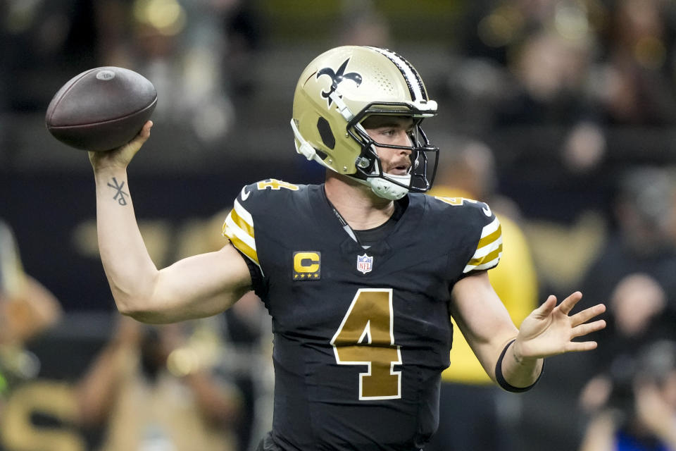 New Orleans Saints quarterback Derek Carr passes against the Carolina Panthers during the first half of an NFL football game in New Orleans, Sunday, Dec. 10, 2023. (AP Photo/Gerald Herbert)
