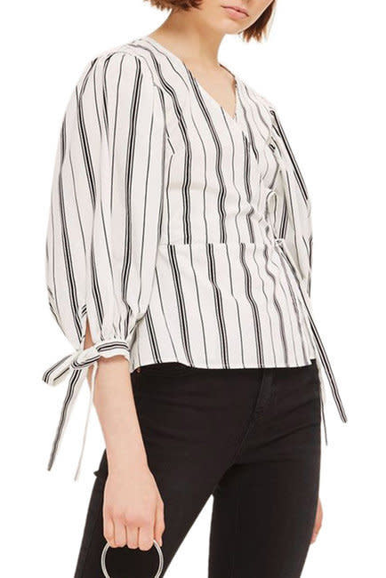 Get it <a href="https://www.nordstromrack.com/shop/product/2273515/topshop-balloon-sleeve-stripe-wrap-top?color=WHITE%20MULTI" target="_blank">here</a>.&nbsp;