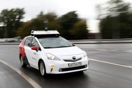 A self-driving car tested by Yandex drives during a presentation in Moscow