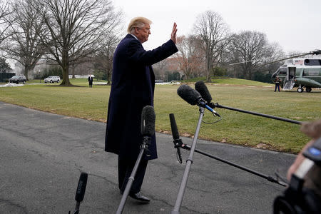 U.S. President Donald Trump waves to the media, ahead of his departure to Dover, Delaware, on the South Lawn of the White House in Washington, U.S., January 19, 2019. REUTERS/Yuri Gripas