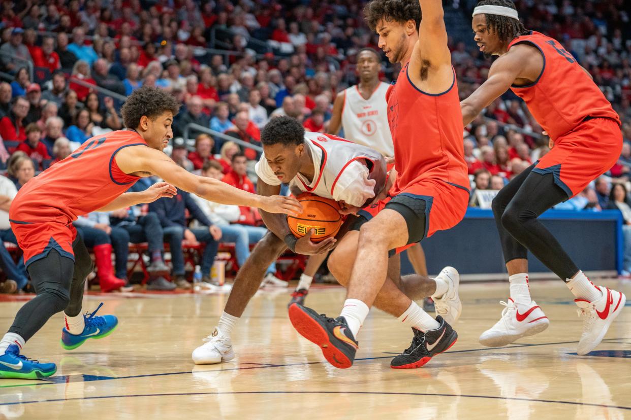 Oct 22, 2023; Dayton, OH, USA;
Ohio State Buckeyes guard Dale Bonner (4) maintains possession of the ball against the Dayton Flyers defenders during their game on Sunday, Oct. 22, 2023 at University of Dayton Arena.