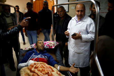 A Palestinian who was wounded at the Israel-Gaza border reacts at al-Shifa hospital in Gaza City April 1, 2018. REUTERS/Mohammed Salem
