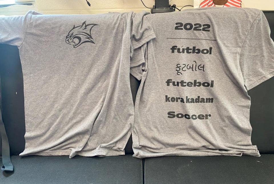 A close up view of both sides of the warm-up T-shirt the Gardner High boys soccer team created to celebrate the multicultural diversity present on this year's roster.