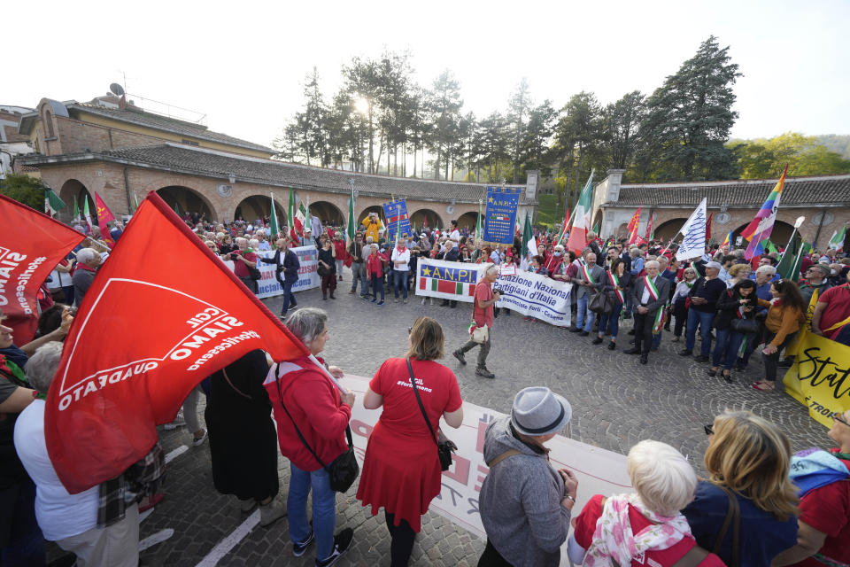 People gather during a march organized by the Italian Partisans association in Mussolini's birthplace Predappio Friday, Oct. 28, 2022, to mark the 78th anniversary of the liberation of the town from the nazi-fascist occupation by Italian Partisans and Polish allied troops, which coincides with the 100th anniversary of the march on Rome. (AP Photo/Luca Bruno)