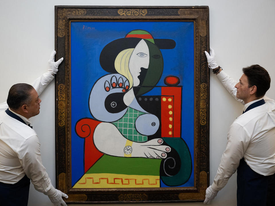 Sotheby's art handlers adjust Pablo Picasso's 