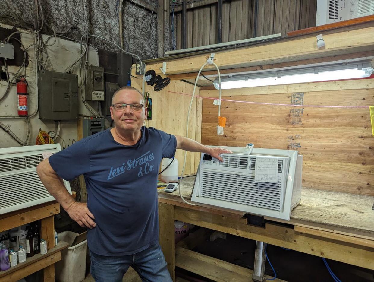 Al Lewenza, of Al's Air Conditioning, says if AC units are not cleaned, this will contribute to the system working overtime.  (Michael Hargreaves/CBC - image credit)