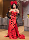 <p>Dita Von Teese wows in a red gown and a heart headpiece at the Milan Fashion Week Moschino fashion show on Thursday in Milan.</p>