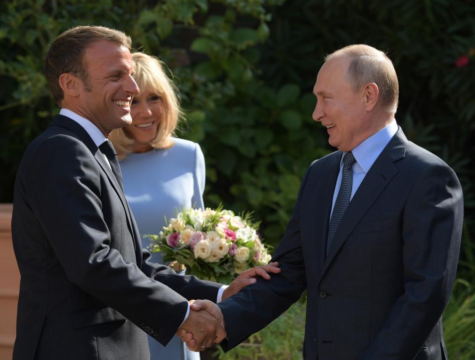 French President Emmanuel Macron, left, his wife Brigitte, welcome Russian President Vladimir Putin at the fort of Bregancon in Bormes-les-Mimosas, southern France, Monday Aug. 19, 2019. French President Emmanuel Macron and Russian President Vladimir Putin are meeting to discuss the world's major crises, including Ukraine, Iran and Syria, and try to improve Moscow's relations with the European Union. (Alexei Druzhinin, Sputnik, Kremlin Pool Photo via AP)