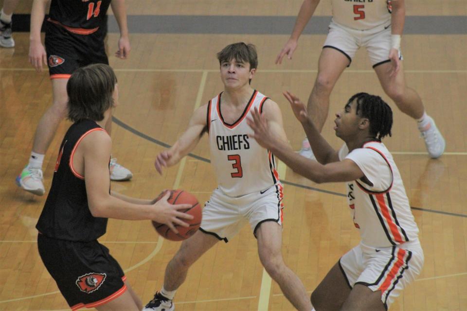 Cheboygan senior teammates Jordan Johnson (right) and Daniel Hudson (middle) trap a Newberry player during a victory back in December.