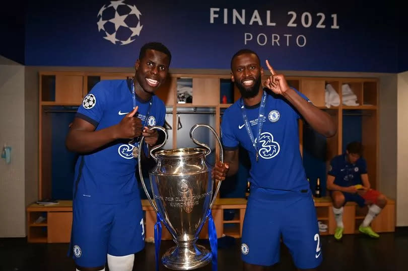 PORTO, PORTUGAL - MAY 29: Kurt Zouma (L) and Antonio Rudiger of Chelsea pose in the dressing room with the Champions League Trophy following their team's victory in the UEFA Champions League Final between Manchester City and Chelsea FC at Estadio do Dragao on May 29, 2021 in Porto, Portugal. (Photo by Darren Walsh/Chelsea FC via Getty Images)