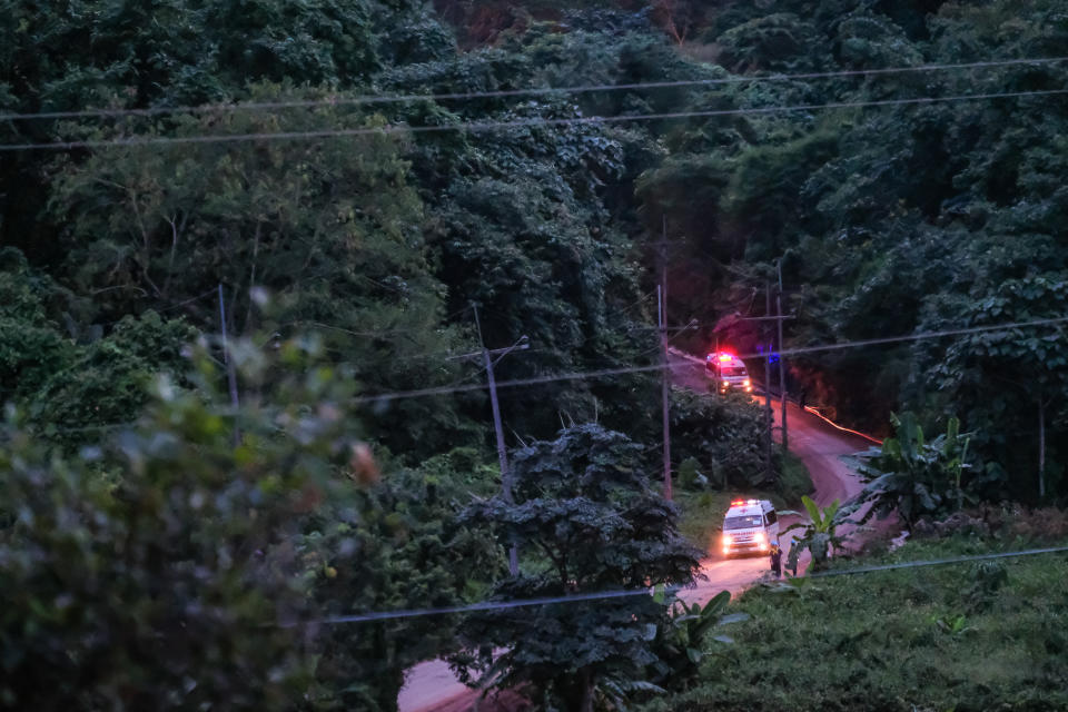 Two ambulances carry the sixth and seventh boys out of Tham Luang Nang Non cave site. Source: Getty