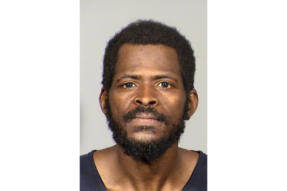 This undated photo provided by the Las Vegas Metropolitan Police Department shows Clinton Taylor, 36, of Las Vegas, following his arrest Thursday, Aug. 29, 2019. Taylor is accused of bludgeoning a woman to death with a sledgehammer while her 911 call from a Las Vegas laundromat went dead. Police say they don't believe the woman knew Taylor. (Las Vegas Metropolitan Police Department via AP)