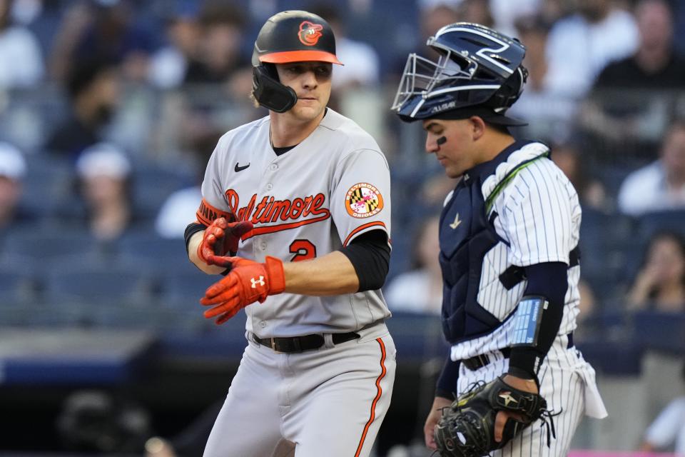 Baltimore Orioles' Gunnar Henderson passes by New York Yankees catcher Jose Trevino after hitting a home run during the first inning of a baseball game Thursday, July 6, 2023, in New York. (AP Photo/Frank Franklin II)