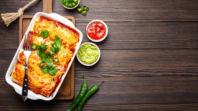 enchiladas in dish peppers sauce