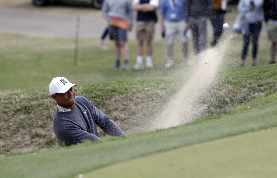 Tiger Woods plays a shot from a bunker on the 18th hole during quarterfinal play at the Dell Technologies Match Play Championship golf tournament, Saturday, March 30, 2019, in Austin, Texas. Woods lost the match to Lucas Bjerregaard. (AP Photo/Eric Gay)