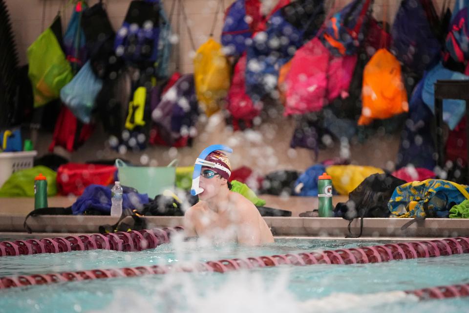 New Albany senior swimmer Kaden Elkovitch doesn't care about comfort as much as how a technical swimsuit "compresses my muscles for maximum performance."