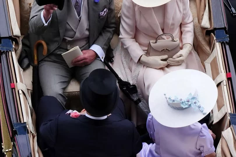 King Charles III, Queen Camilla, Sheikh Hamad bin Khalifa Al Thani and Lady Charles Spencer-Churchill arrive by carriage on day five of Royal Ascot