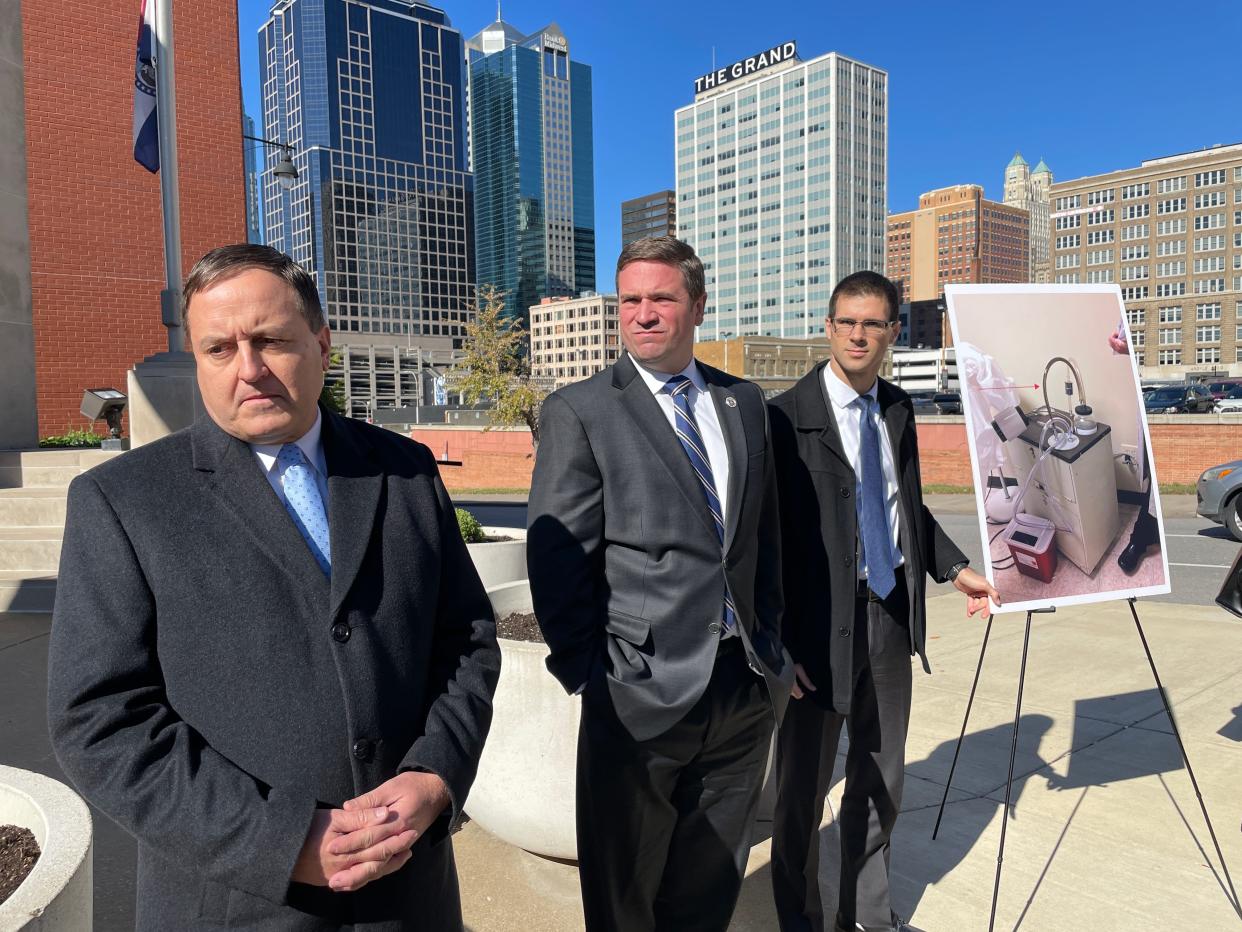 After a hearing at the Western District Court of Appeals in Kansas City on Oct. 30, 2023, Missouri Secretary of State Jay Ashcroft, Attorney General Andrew Bailey and Missouri Solicitor General Josh Divine display a photo of moldy abortion equipment that they insist could be used without legal ramifications if abortion ballot initiatives are passed.