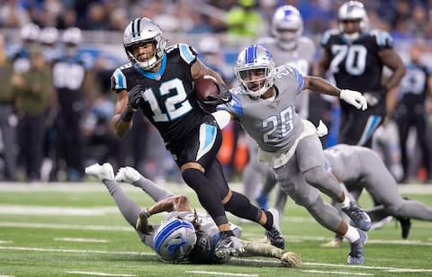 DJ Moore #12 of the Carolina Panthers runs for a short gain as Quandre Diggs #28 of the Detroit Lions gives chase during the first quarter of the game at Ford Field - Credit: Leon Halip/Getty Images