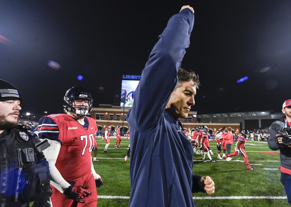 Liberty coach Jamey Chadwell celebrates the team's win over New Mexico State during the Conference USA championship NCAA college football game Friday, Dec. 1, 2023, in Lynchburg, Va. (Paige Dingler/The News & Advance via AP)