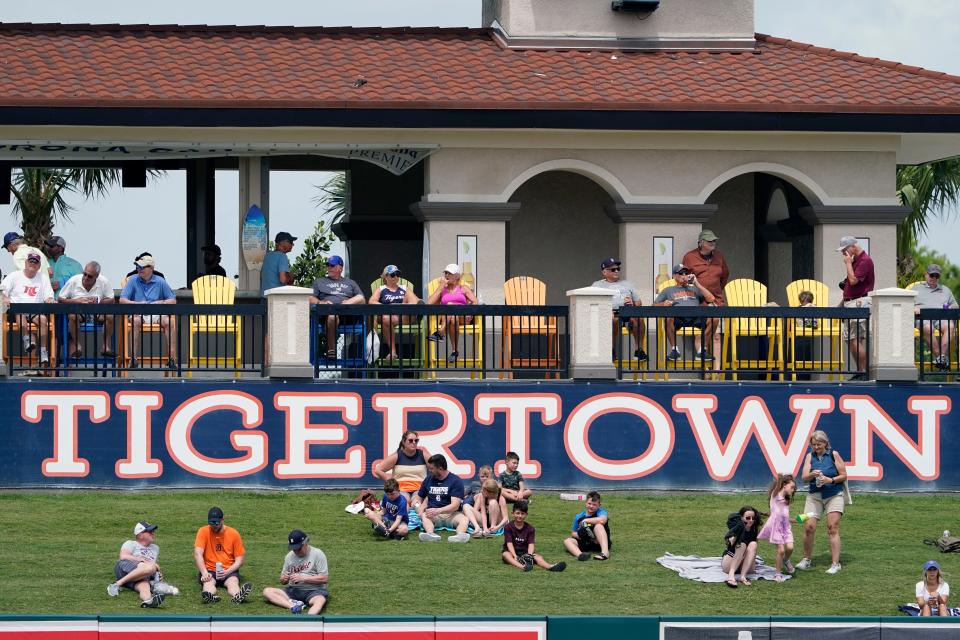 Fans watch a spring baseball exhibition game between the Detroit Tigers and the Pittsburgh Pirates, Wednesday, March 23, 2022, in Lakeland, Fla.