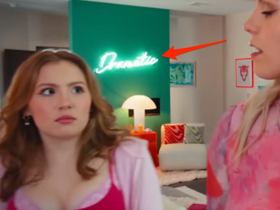 A red arrow pointing to a sign that reads "dramatic" in the 2024 version of "Mean Girls."