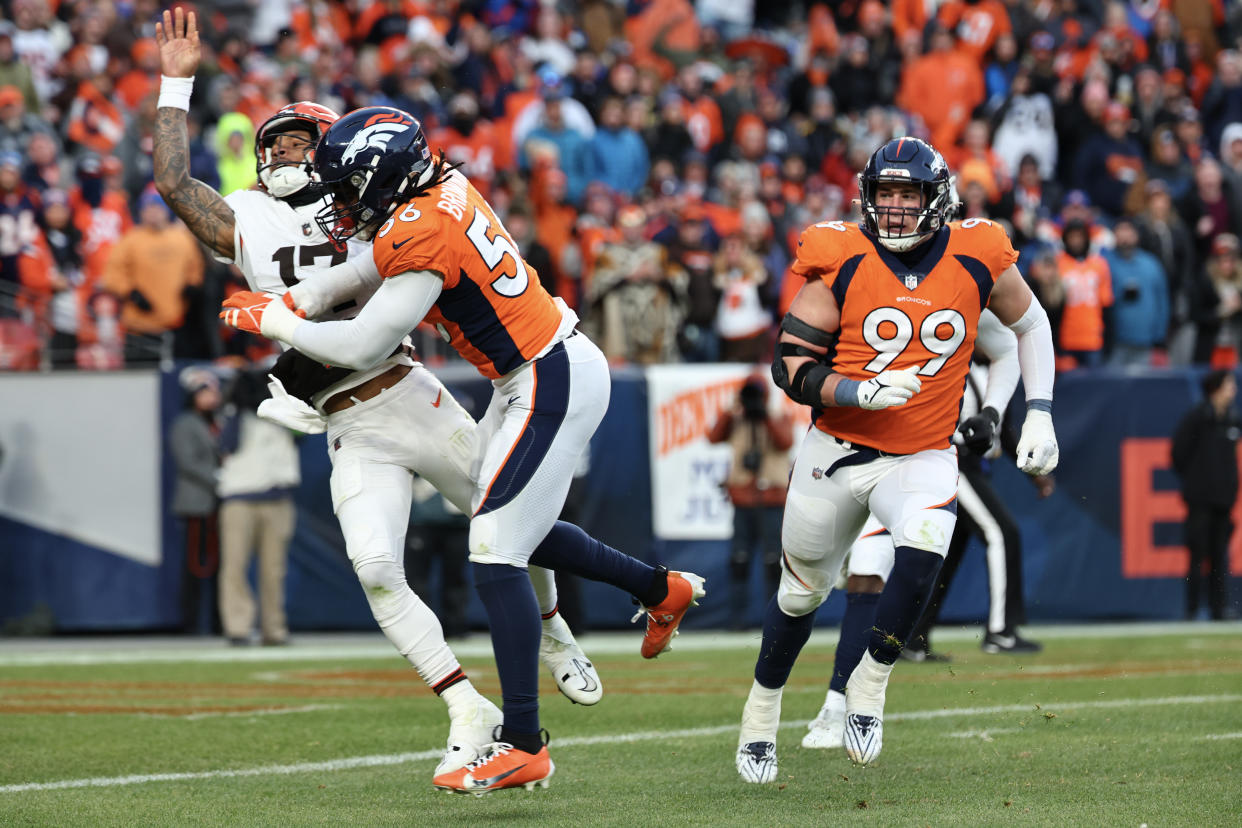 DENVER, COLORADO - NOVEMBER 26: Baron Browning #56 of the Denver Broncos hits Dorian Thompson-Robinson #17 of the Cleveland Browns on a play in the third quarter of the game at Empower Field At Mile High on November 26, 2023 in Denver, Colorado. Thompson-Robinson was injured on the play. (Photo by Jamie Schwaberow/Getty Images)