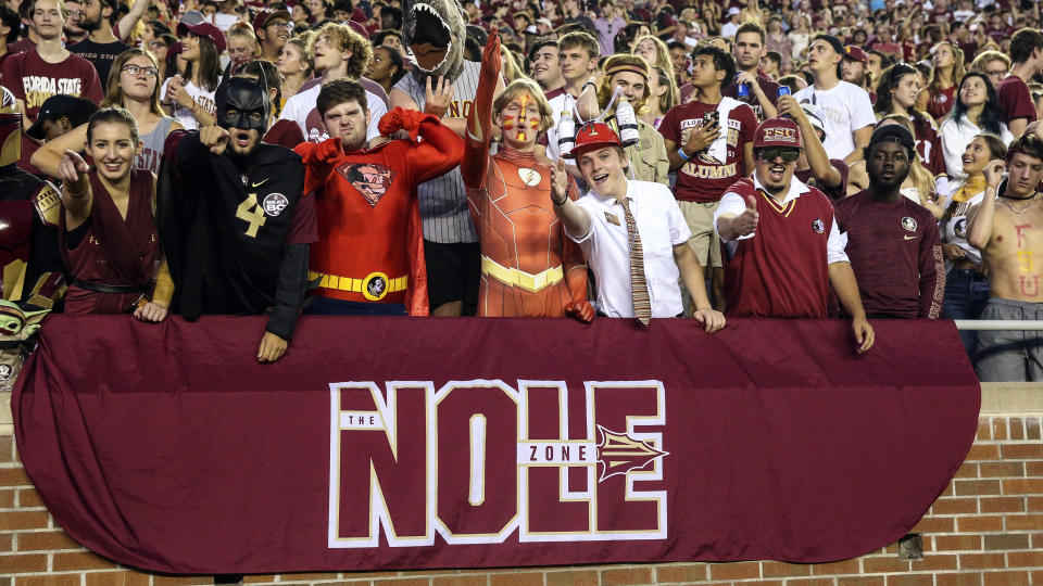 Florida State fans pose before an NCAA college football game against Boston College on Saturday, Sept. 24, 2022, in Tallahassee, Fla. (AP Photo/Gary McCullough)