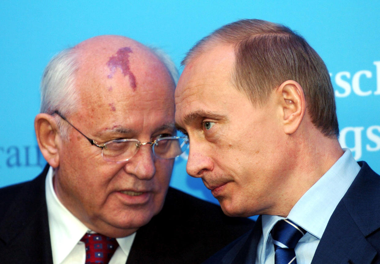 FILE - Russia's President Vladimir Putin, right, talks with former Soviet President Mikhail Gorbachev at the start of a news conference at the Castle of Gottorf in Schleswig, northern Germany, Tuesday, Dec. 21, 2004. Russian news agencies are reporting that former Soviet President Mikhail Gorbachev has died at 91. The Tass, RIA Novosti and Interfax news agencies cited the Central Clinical Hospital. (Carsten Rehder/dpa via AP)