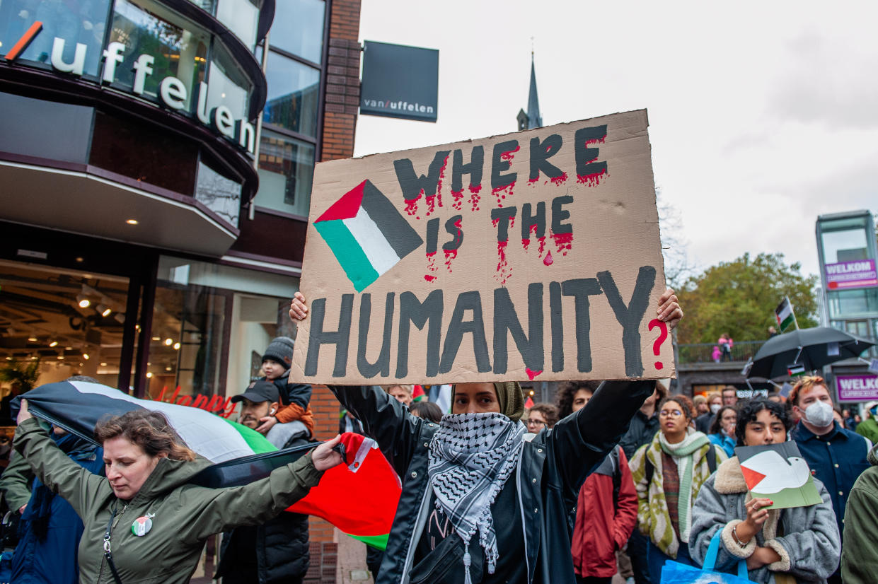 NIJMEGEN, GELDERLAND, NETHERLANDS - 2023/11/05: A woman is seen holding a placard expressing her opinion during the demonstration. Hundreds of people took to the streets of the city center of Nijmegen in support of Palestine and to protest Israel's retaliatory attacks on Gaza. The protesters were calling for a ceasefire in Gaza where Israeli attacks have resulted in over 9000 deaths, including thousands of children. (Photo by Ana Fernandez/SOPA Images/LightRocket via Getty Images)