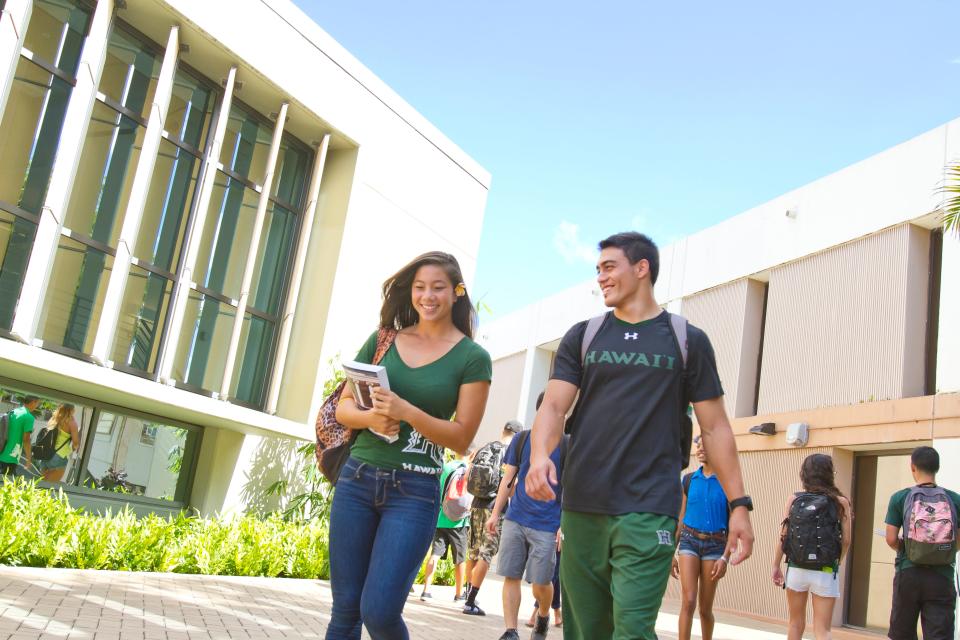 University of Hawaii students walk through Manoa's campus center.