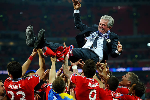 Head Coach Jupp Heynckes of Bayern Muenchen is thrown into the air by his players after winning the UEFA Champions League final match against Borussia Dortmund at Wembley Stadium.