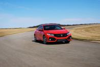 <p>For the Si, Honda adds even more zaniness to the 10th-generation Civic’s already over-the-top styling. The plastic prow that juts out over the grille, between the headlights, is totally blacked out, as are the gaping pseudo-intakes at each front corner.</p>