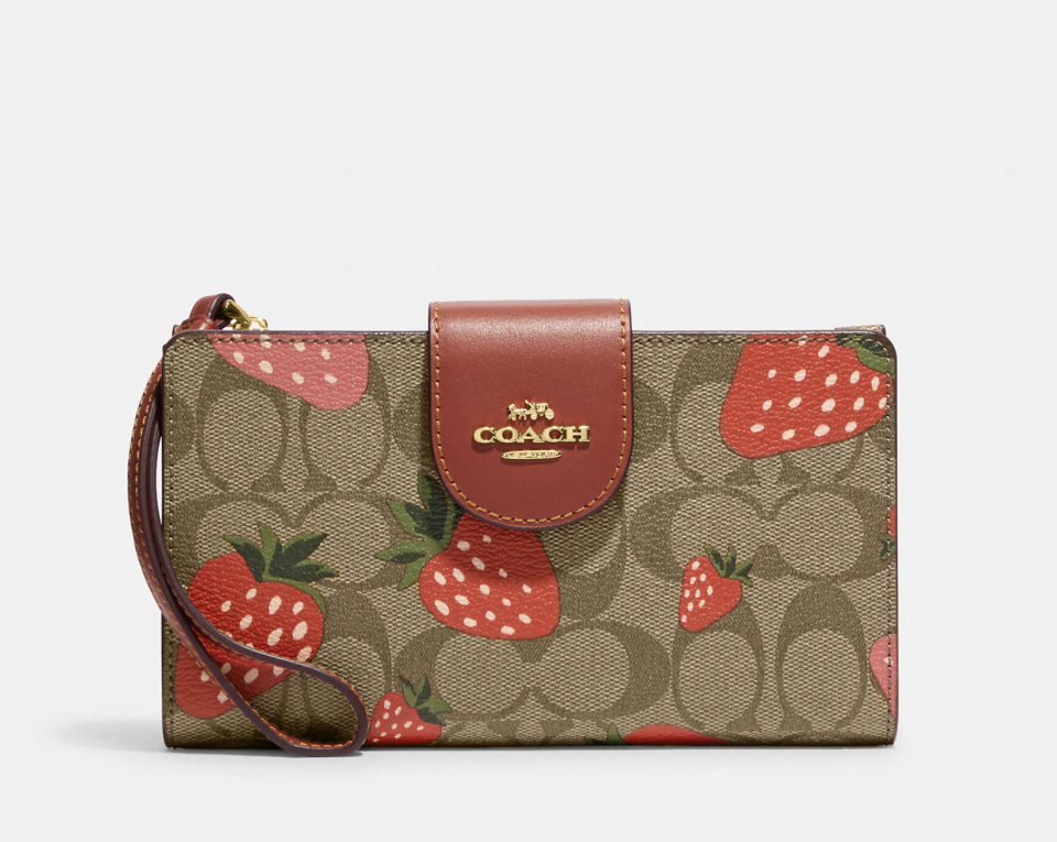 Tech Wallet in Signature Canvas with Wild Strawberry Print (Photo via Coach Outlet)