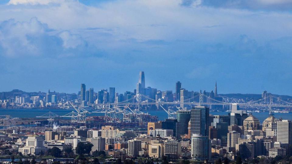 Tumultuous clouds move over the San Francisco Bay Area seen from the hills of Oakland after raining on Friday. A stronger storm system will wreak havoc on California and could trigger flooding, wind damage and more, forecasters say.