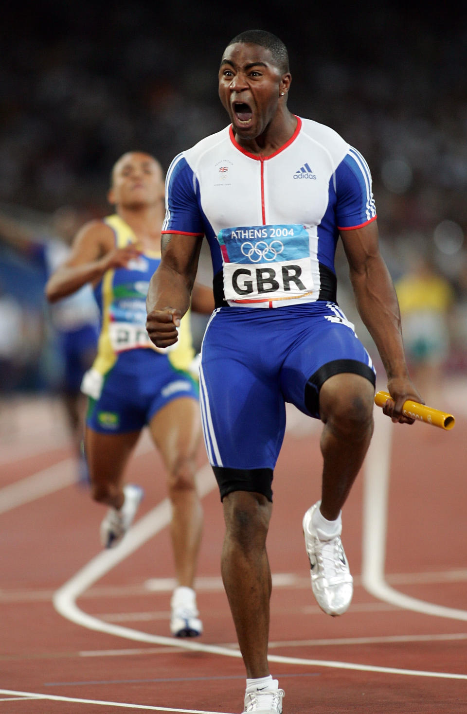 ATHENS - AUGUST 28: Mark Lewis-Francis of Great Britain celebrates after Great Britain won the men's 4 x 100 metre relay final on August 28, 2004 during the Athens 2004 Summer Olympic Games at the Olympic Stadium in the Sports Complex in Athens, Greece. (Photo by Michael Steele/Getty Images)