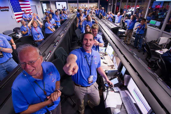 The Mars Science Laboratory (MSL) team in the MSL Mission Support Area reacts after learning the the Curiosity rover has landed safely on Mars and images start coming in at the Jet Propulsion Laboratory on Mars, Sunday, Aug. 5, 2012 in Pasadena