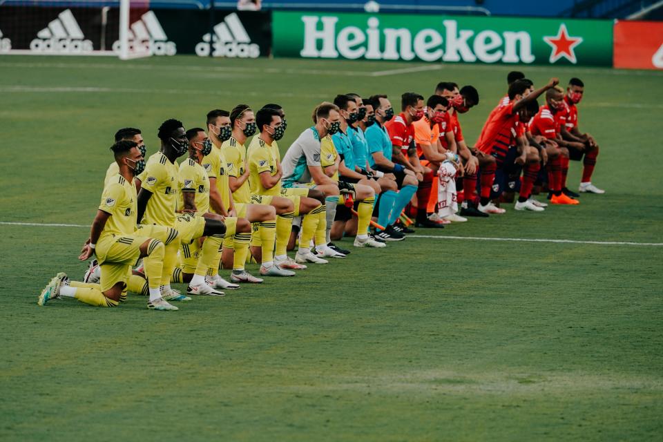 Nashville SC and FC Dallas players kneel during national anthem ahead of MLS match Aug. 12, 2020 at Toyota Stadium in Frisco, Texas.