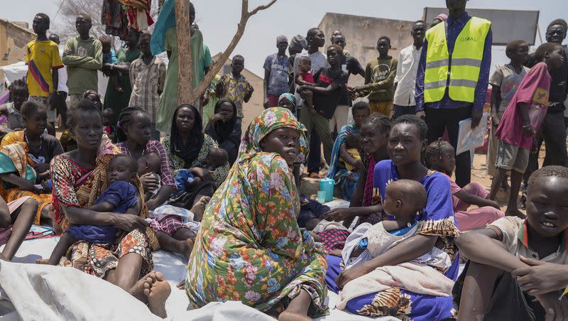 South Sudanese who fled from Sudan sit outside a nutrition clinic at a transit center in Renk, South Sudan, on May 16, 2023.