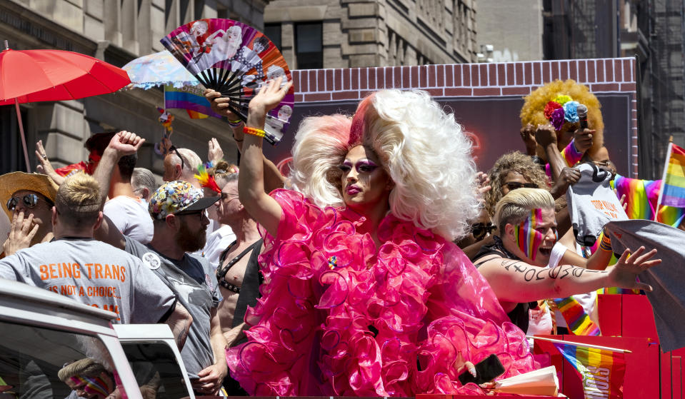 People participating in the LBGTQ Pride march ride past the crowd on a float Sunday, June 30, 2019, in New York. (AP Photo/Craig Ruttle)