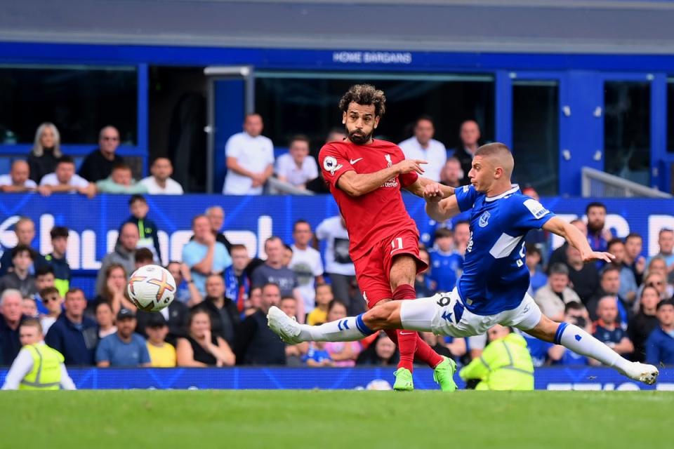 Mohamed Salah of Liverpool is challenged by Vitaliy Mykolenko of Everton as their shot hits the post (Getty Images)