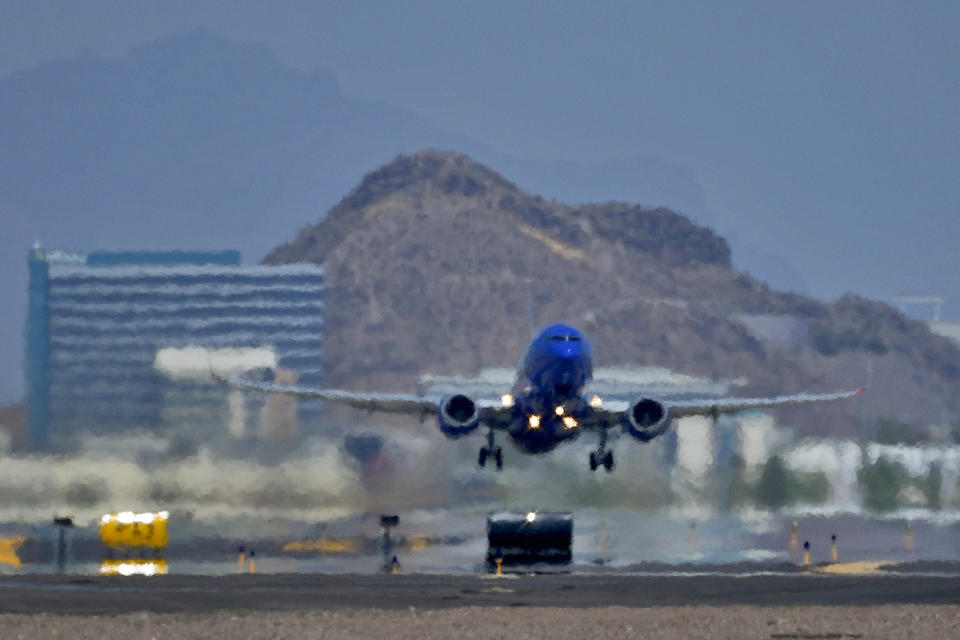 A jet takes flight as heat ripples radiate from the runway, Tuesday, July 25, 2023 at Sky Harbor International Airport, in Phoenix. The city so far this year has seen 52 days of highs at 110 degrees or over and is expected to hit that mark again on both Saturday, Sept. 9, and Sunday. (AP Photo/Matt York)