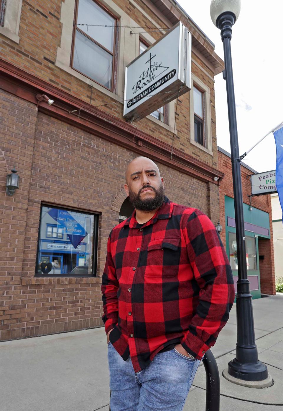 Rev. Michael Thomas, pastor of House of Saints, poses outside, Wednesday, June 24, 2020, The Upper Room, in Sheboygan, Wis. The Upper Room is a location he uses for his church. Thomas is among the leadership that is creating a voice for the Sheboygan area Black community.