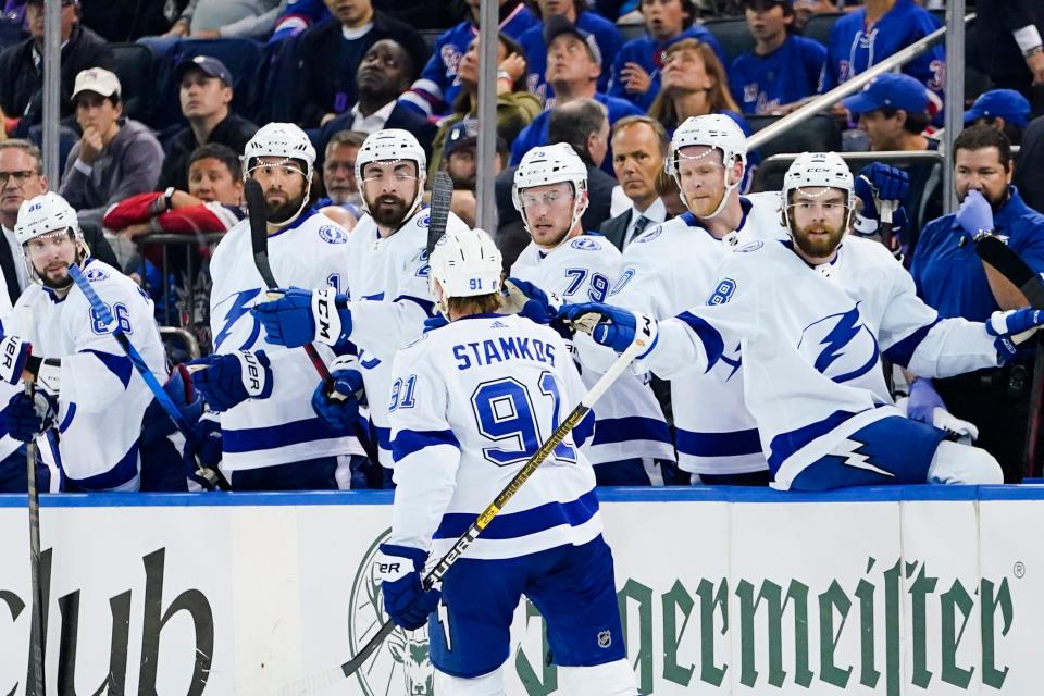 Tampa Bay Lightning's Steven Stamkos (91) is congratulated after scoring a goal against the New York Rangers during the first period in Game 1 of the NHL hockey Stanley Cup playoffs Eastern Conference finals Wednesday, June 1, 2022, in New York. (AP Photo/Frank Franklin II)